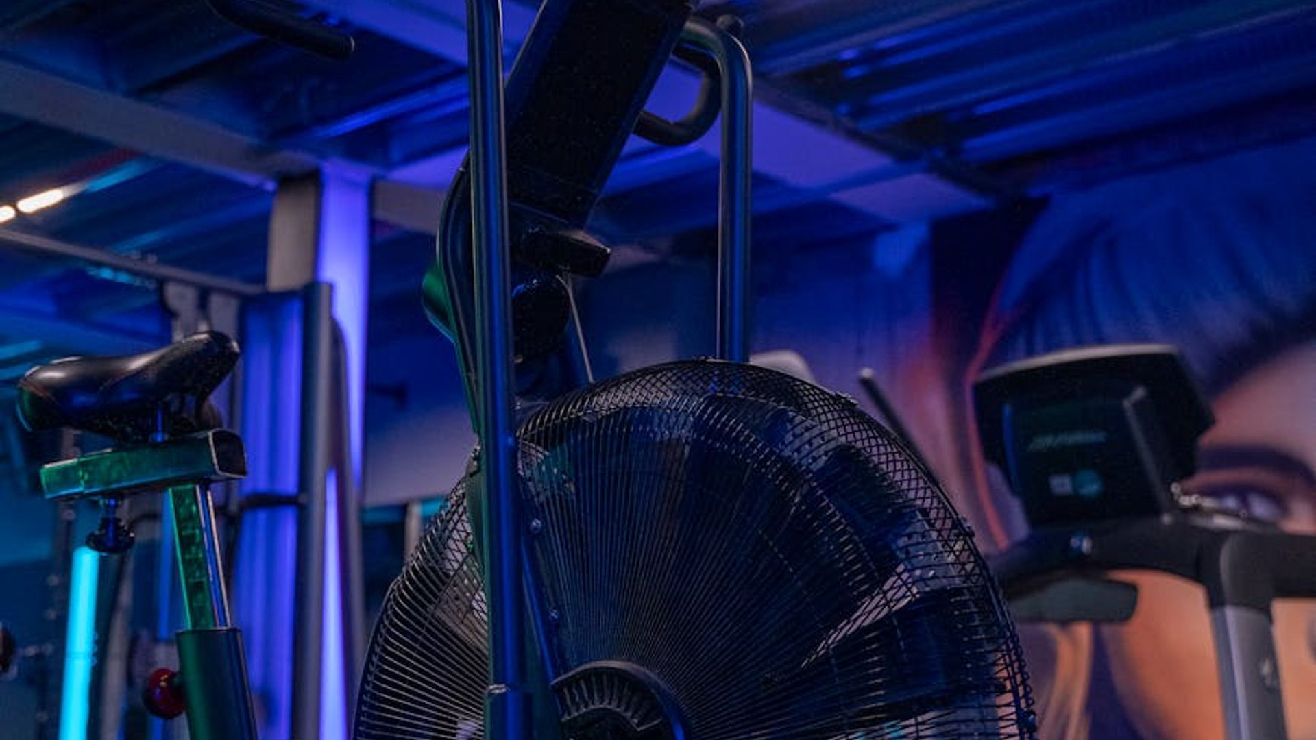 Person doing light cardio in a bright modern studio.