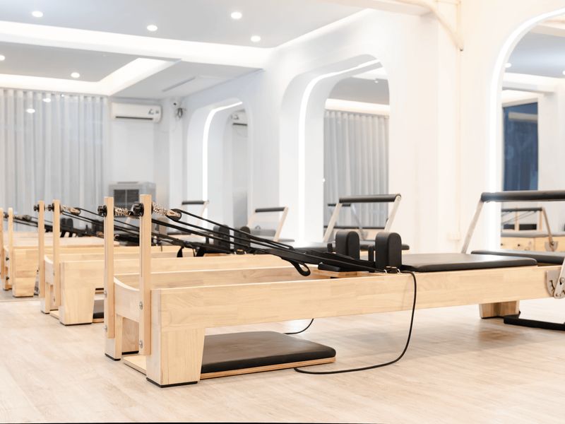Spacious minimalist exercise studio with natural light.